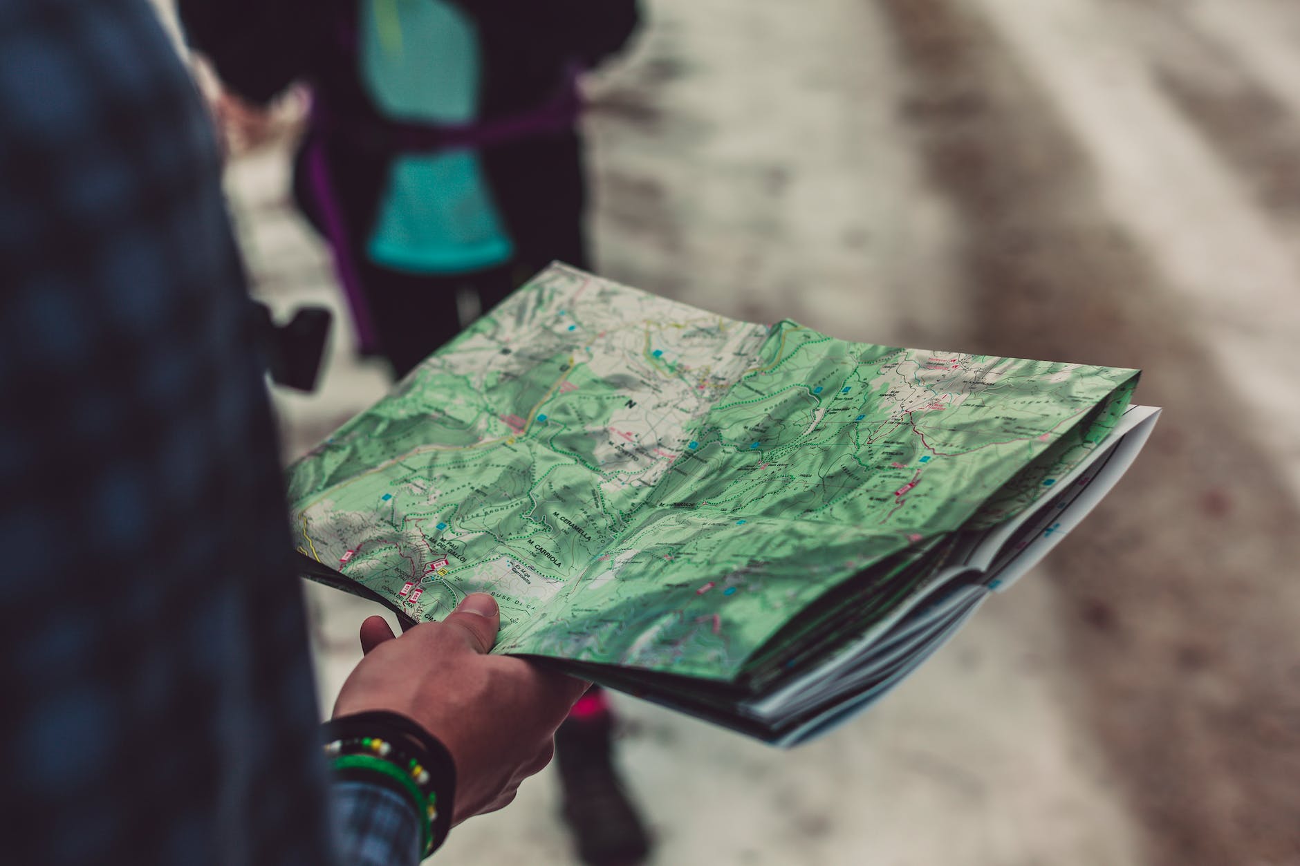 person holding outlined map