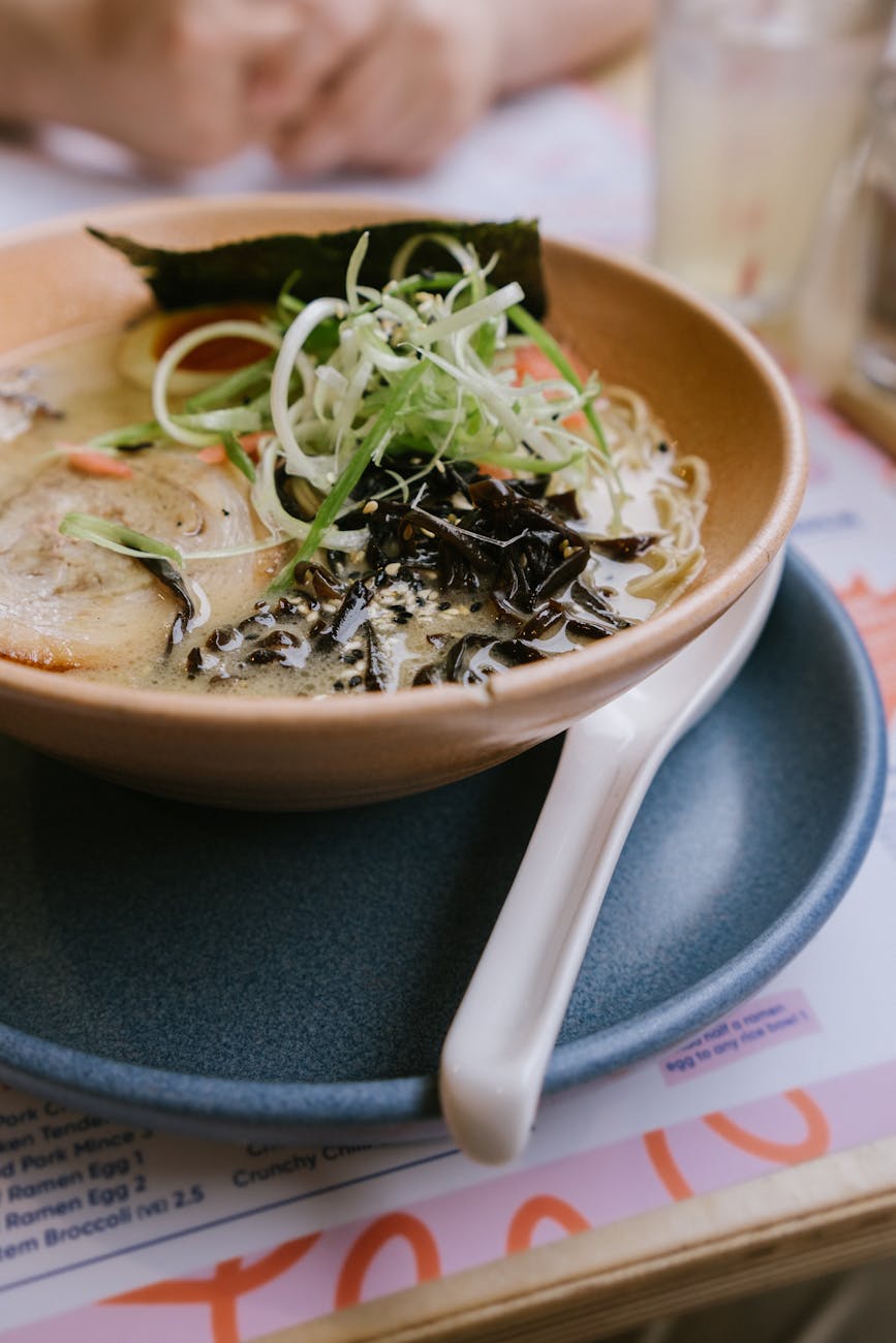 bowl of ramen with pork and seaweeds